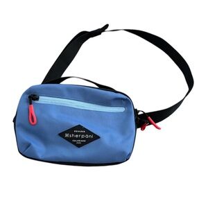 Sherpani Blue Waist Bag with Black Strap and Coral Accents